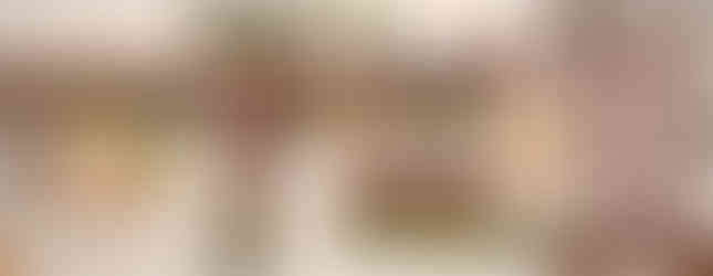 Top-down pixelated cafe view. A fox character stands near a counter. An inventory menu on the right shows various furniture items, with a square wooden "Table" selected for placement.