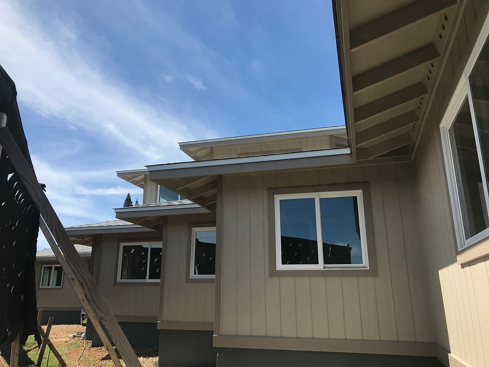 Freshly painted exterior walls under a clear blue sky