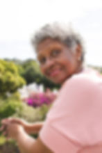senior-biracial-woman-with-curly-gray-hair-smiles-2024-03-15-17-45-56-utc.jpg