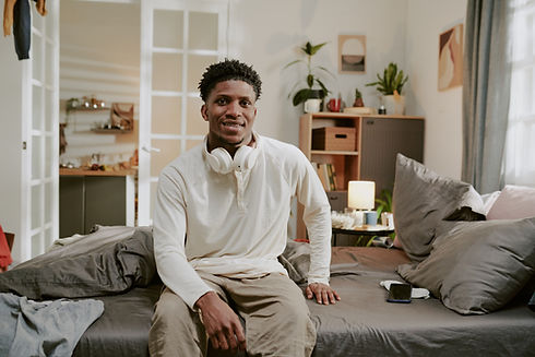 portrait-of-man-sitting-in-living-room-with-headph-2025-06-10-08-27-12-utc.jpg