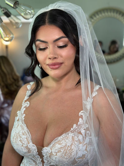 Soft champagne eyeshadow with long-wear lashes on bride at Belle Mer, Newport