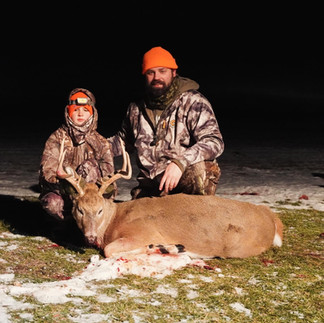 Father and son with late season muzzleloader buck