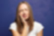 Girl suffering from severe tooth pain at dental clinic sullivan