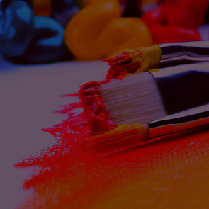 three silver paint brushes on white textile_edited.jpg