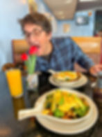 A man enjoying breakfast and flowers in Delavan, WI