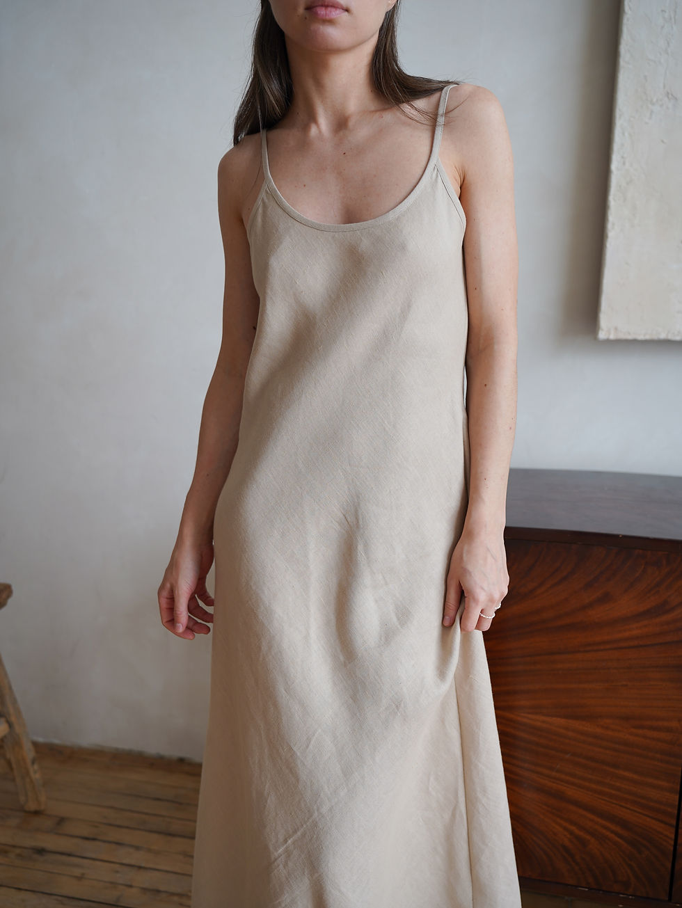 Thumbnail: Lightweight and airy linen wedding guest dress with a sleek, elegant fit