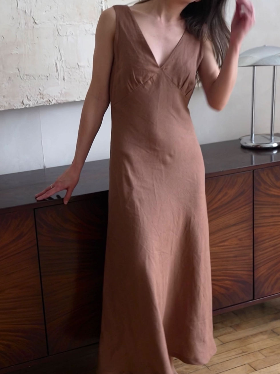 Thumbnail: Soft linen wedding guest bias cut dress with wide straps and a deep V-neck, designed for effortless everyday style