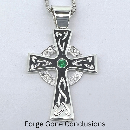 Celtic Cross Necklace with Emerald Closeup on White Background