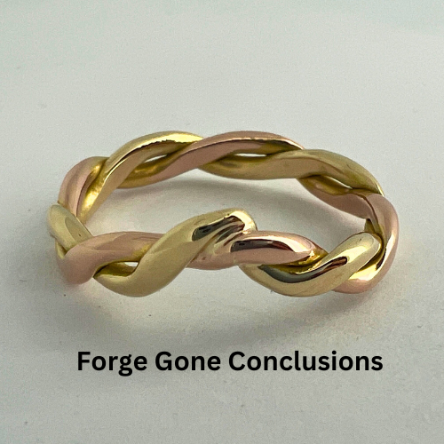 Yellow and Rose Gold Twist Wedding Ring On White Background