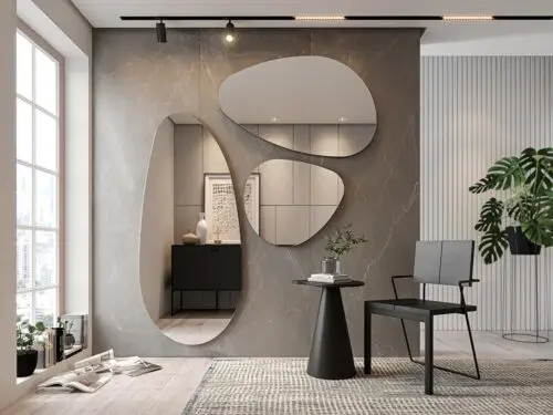Decoração elegante e sofisticada com espelhos orgânicos grandes em parede de cimento queimado.