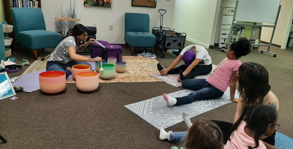 Sunshine volunteers her time at Metaphysical Market. Free sound healing session for moms, kids and more.