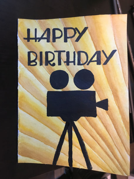 "Happy Birthday" and a silhouette of a vintage camera