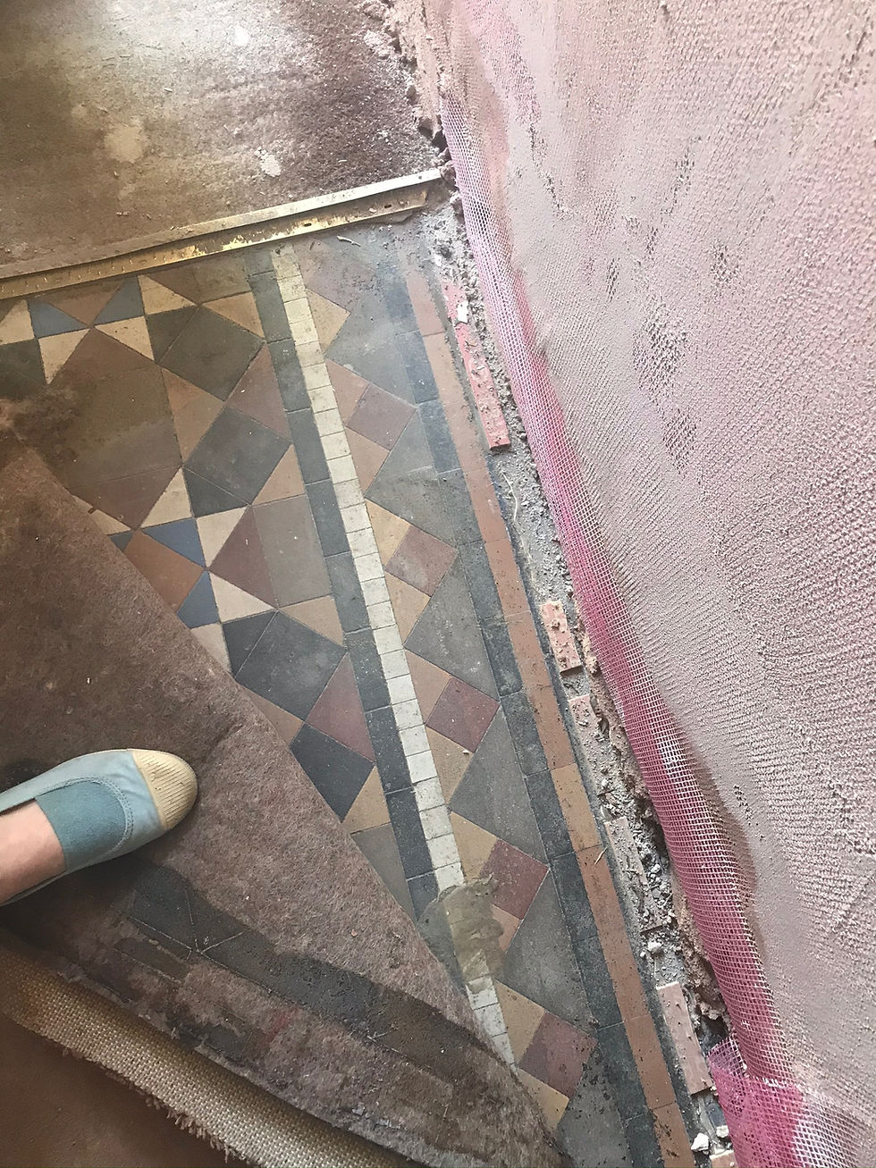 The old tiles which we found under the carpet