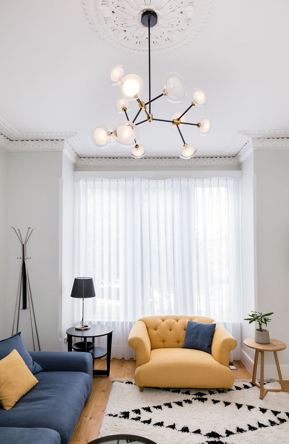The old heavily patterned Curtin was replaced with a see throw light fabric which brings the light in but keeps the privacy from the street.