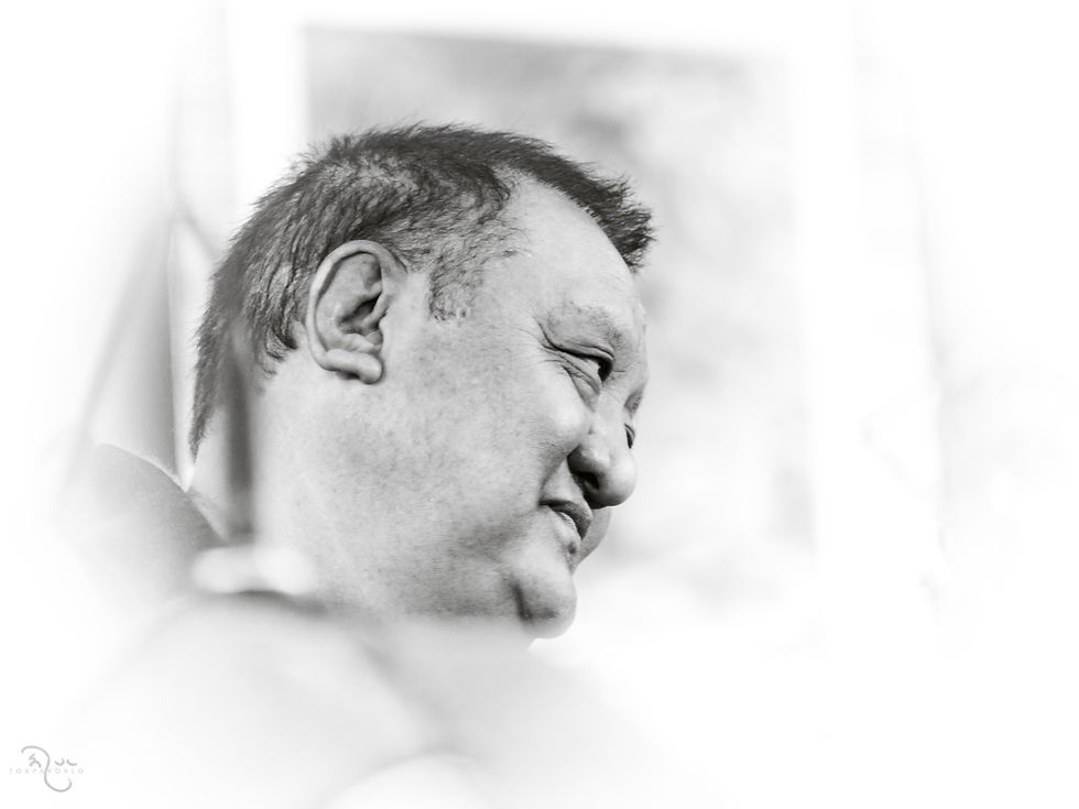 A softly toned monochrome portrait shows a figure in side profile looking into the distance — Location not specified — Jun 11, 2023 — Nine years ago my teacher died. — June 2023 — Shamar Rinpoche - My Guiding Light — photograph by Tokpa Korlo