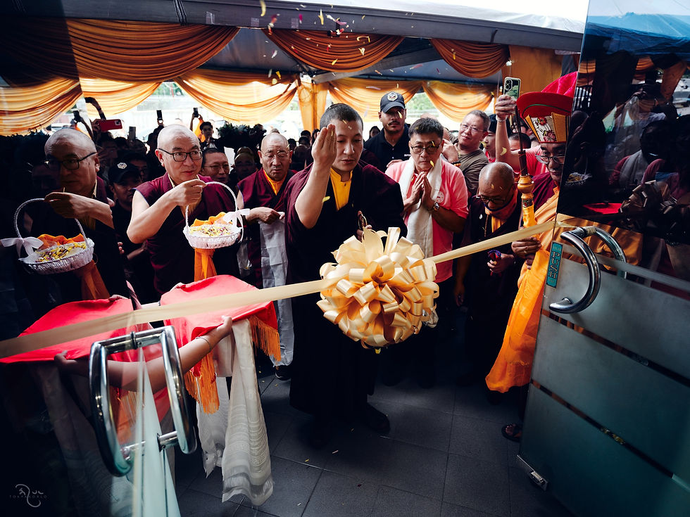A lively ceremonial gathering fills a covered outdoor space as participants carry large decorated drums and ritual objects — Malaysia — Jul 5, 2026 — Malaysia 2026 - Finality, Contentment — photograph by Tokpa Korlo