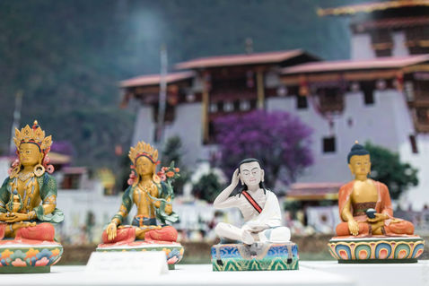 Rows of varied statues displayed before a view of the stupa grounds — Benalmadena, Malaga, Spain — February 2015 — The Statues of Benalmadena Enlightenment Stupa — photograph by Tokpa Korlo
