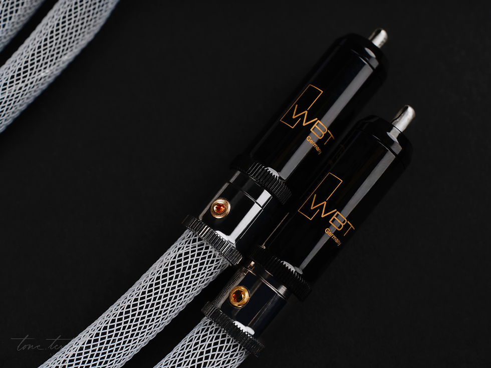 Close-up of Arctand Celestine² WBT RCA connectors on a black background