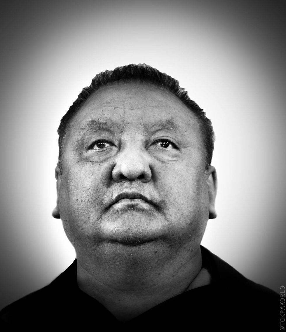 A monochrome close-up portrait looks upward against a softly shaded background — Indoor portrait studio — February 11, 2016 — Today is a very special day for me. Today marks five years since I made the choice to live, to break free f... — photograph by Tokpa Korlo