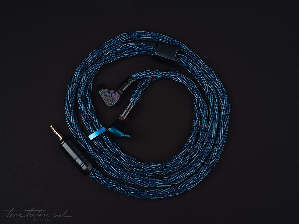 Symphonium Zenith IEMs with a large coiled blue braided upgrade cable