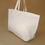 Thumbnail: Oversize tote bag with zip top fastening.