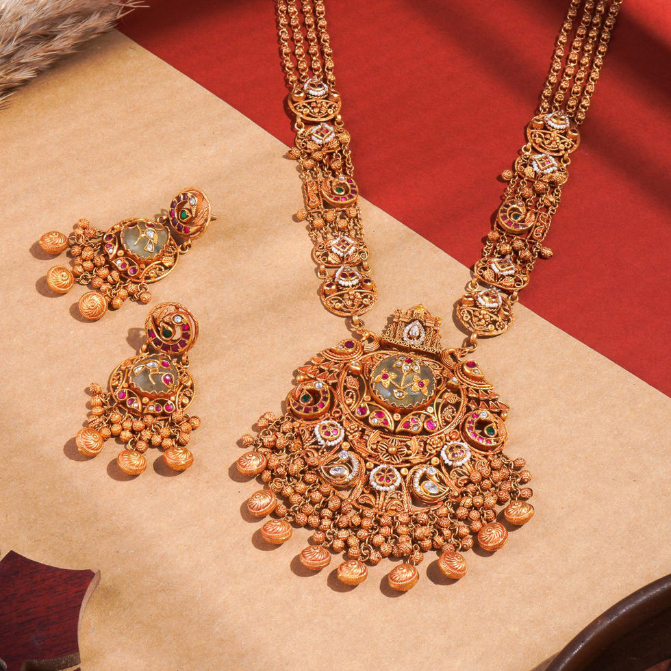 Ornate gold jewelry set with intricate designs.