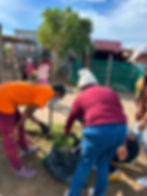 Volunteers planting during community outreach missions.
