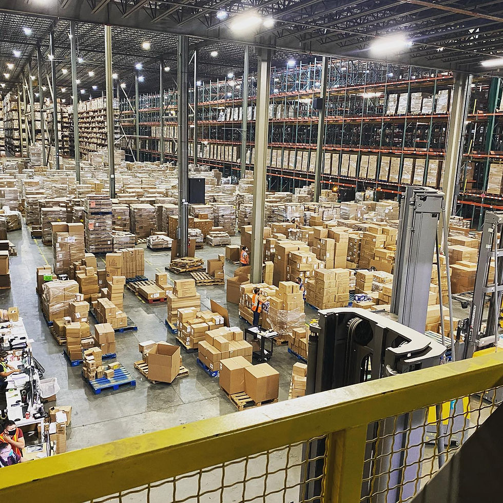 A warehouse with inventory secured by commercial surveillance and access control systems.