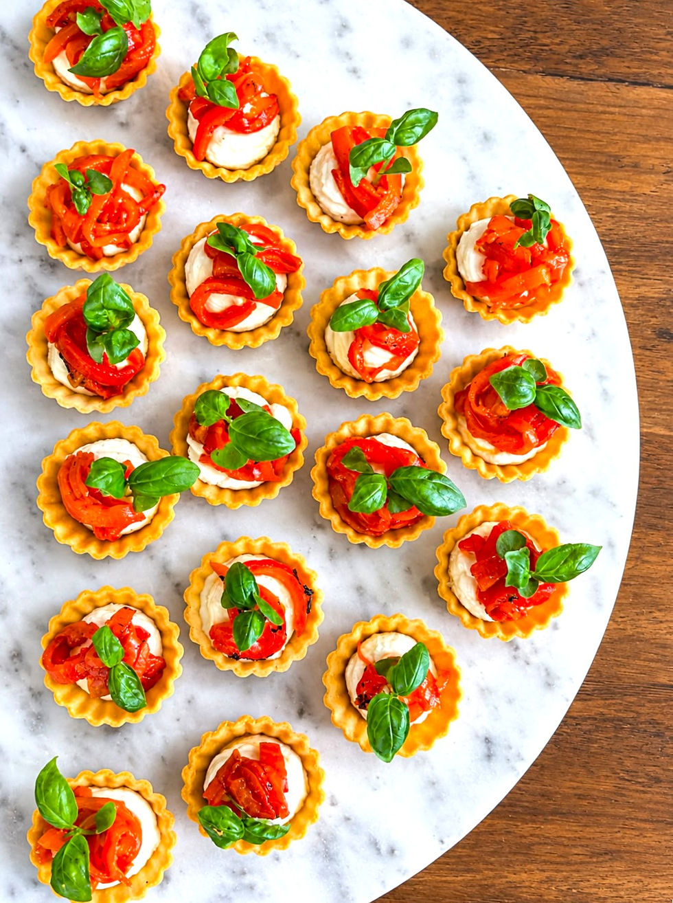 Freshly prepared whipped feta, pepper and basil tartlet canapés, beautifully presented by YR Events for a 50th wedding anniversary in Caterham, Surrey.