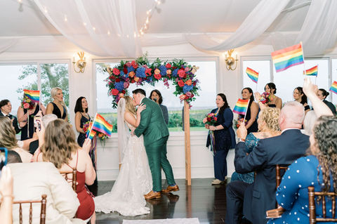 a young newlywed couple kissing at their secular wedding officiated by Cantor Stein in Old Saybrook, Connecticut