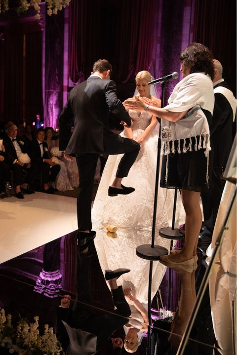 a groom breaking the glass at his co-officiated wedding in New York City, New York