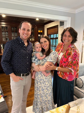 Young parents and their baby smiling with Cantor Stein at their Jewish Baby Naming ceremony in Hartford, Connecticut