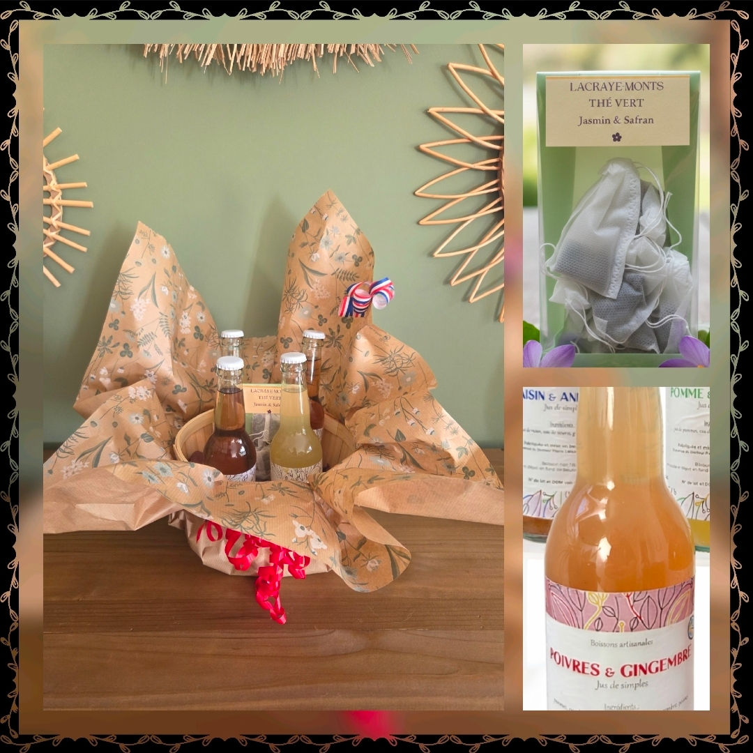 Un coffret cadeau , une bouteille de jus de fruit et un sachet de thé