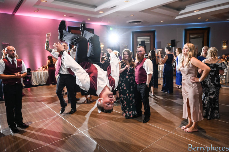 guests at this wedding are literally flipping each other upside down on the dance floor at this Cape Cod wedding.
