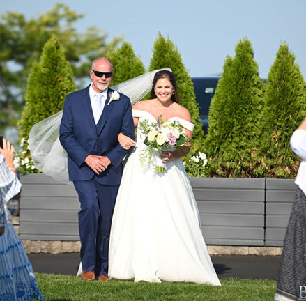 Can you see the parking lot from the aisle at the outdoor ceremony location at Granite Links in Quincy MA?  Not really.  They did a great job covering it all with bushes to create a screen.
