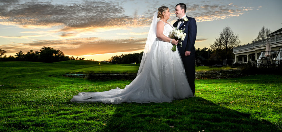 Technically perfect wedding photography showing sunset perfectly exposed with all it's deep rich colors with off-camera flash lighting the bride and groom perfectly.
