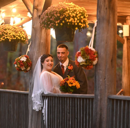 Camp Kiwanee in Hanson MA has an amazing rustic deck with warm twinkle lights and wooden beams.