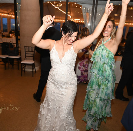 Bride centered on the dance floor with her friends at Plimoth Patuxet formerly known as Plymouth Plantation