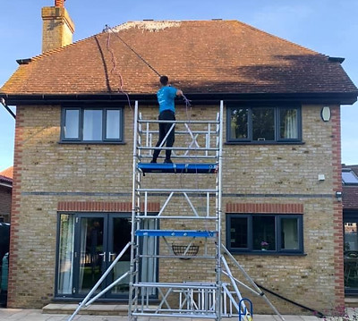 Roof being soft washed by CR Cleaning Kent