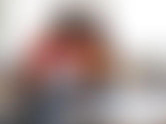 Happy couple planning family budget and reviewing financial documents during Financial Literacy Month.