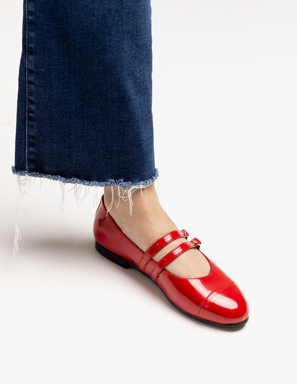 Thumbnail: Model wearing The Mary Jane Cherry Red flats by Turf – flirty, feminine, and chic