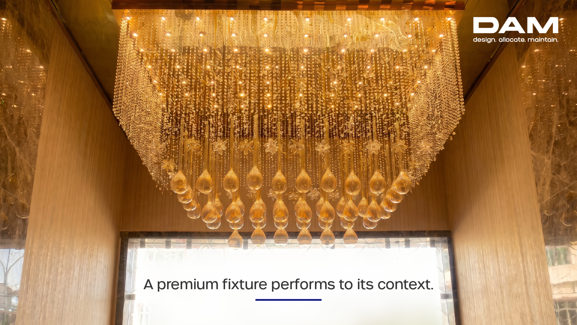 Luxury crystal chandelier installation showcasing premium architectural lighting design in a high-end commercial interior, demonstrating how a statement fixture performs within its spatial context.