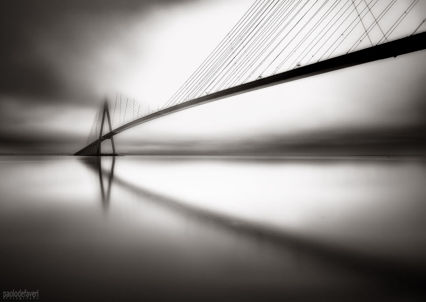 A moody view of the famous bridge spanning the Seine river near Honfleur, known as Pont de Normandie