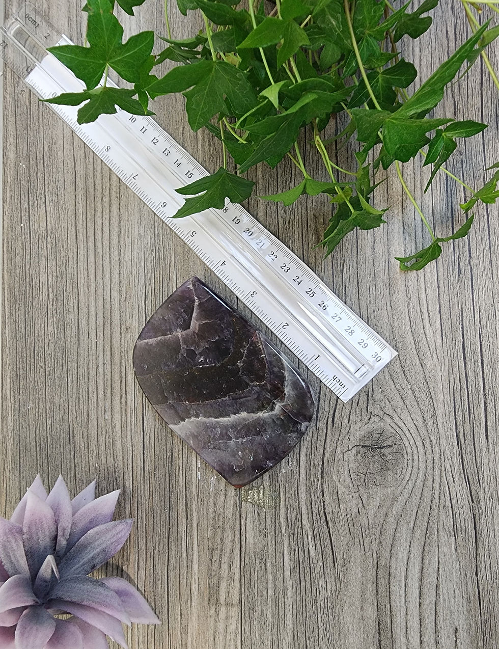 Thumbnail: Polished piece of auralite 23 with ruler to show size