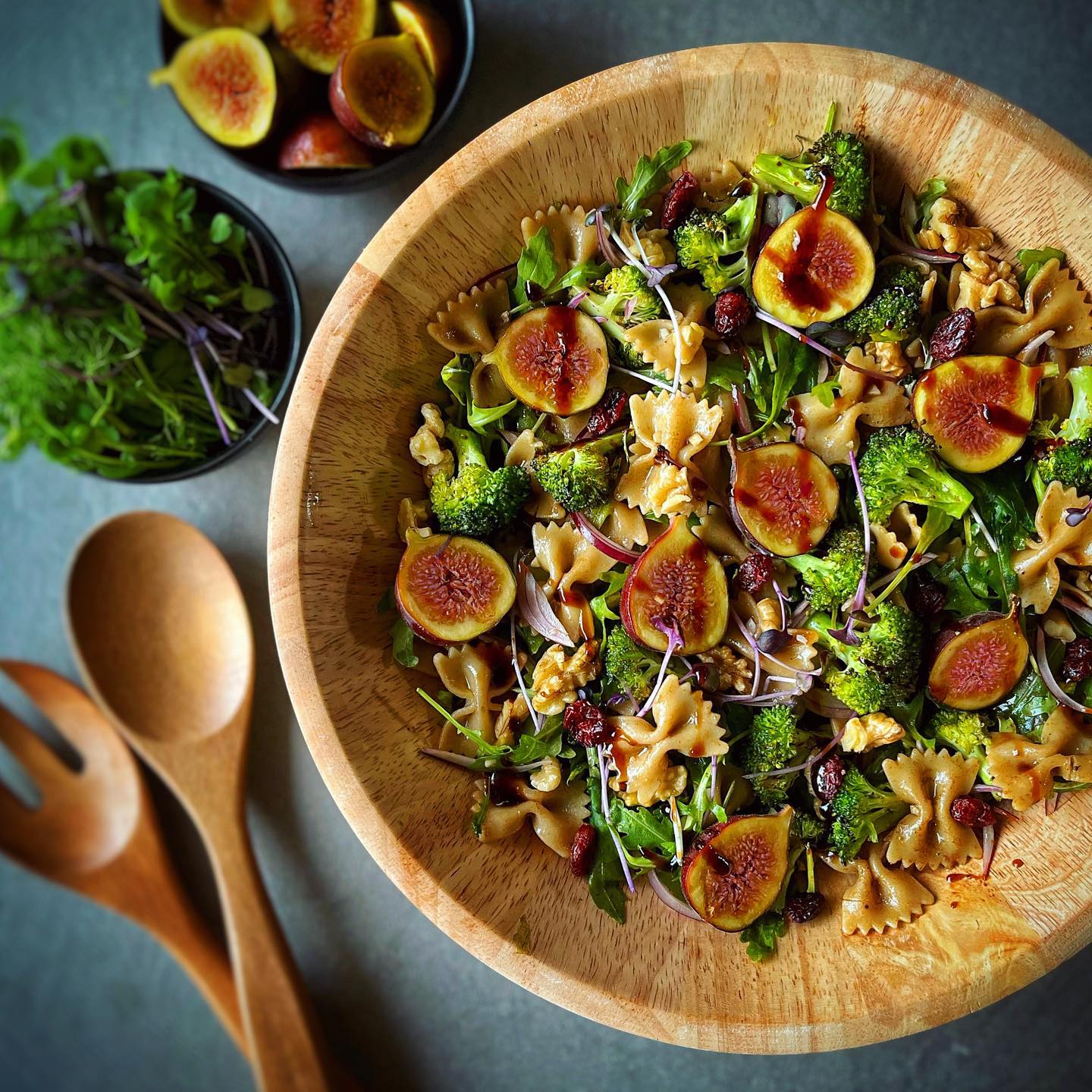 Fig and arugula pasta salad with roasted broccoli, walnuts, cranberries, and balsamic dressing