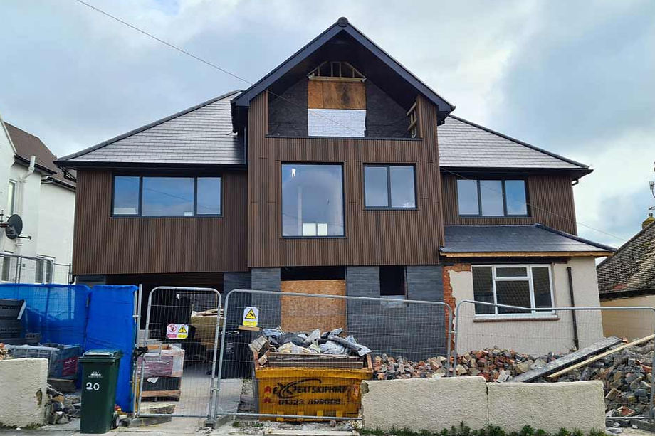 Photograph of the front elevation of the extended house while in progress on site