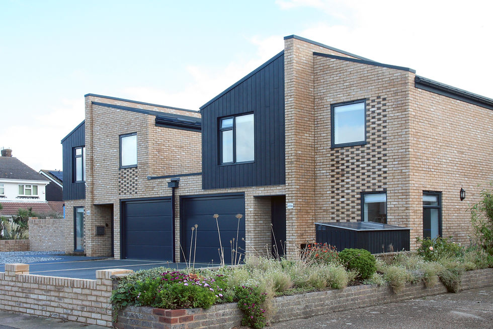 front elevation photo of the semi-detached new-build houses in shoreham finished in buff brick and black cladding