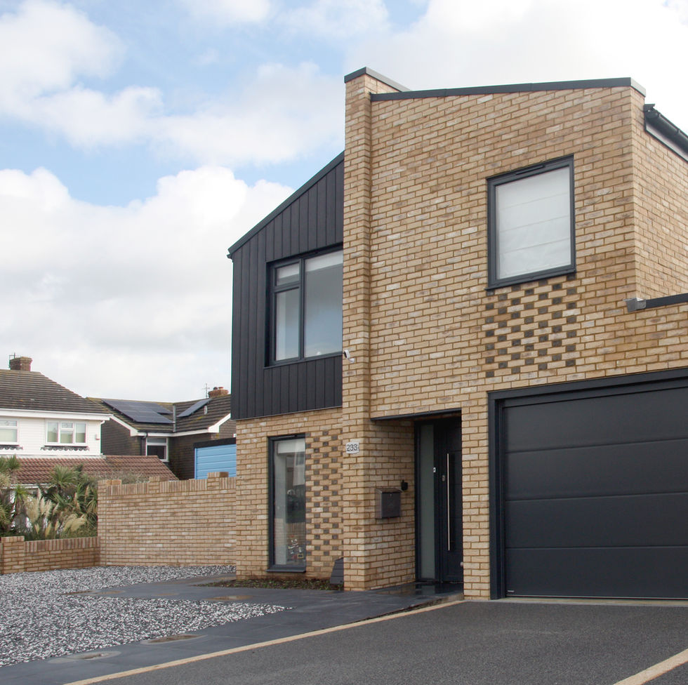 Front elevation photo of the semi-detached new-build houses in shoreham finished in buff brick and black cladding
