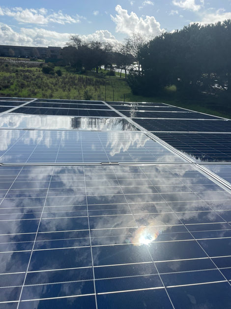 Clean and reflective solar panels after a professional eco-friendly cleaning by Pacific Cleaning Group, ensuring maximum energy efficiency.
