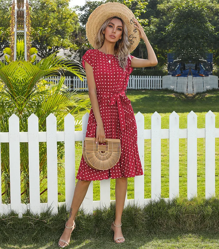 Step into timeless charm with our Polka Dot Short Sleeve Bandage Pleated Midi Dress – a perfect blend of style and sophistication.